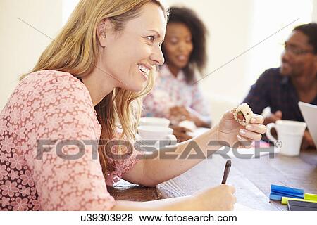 Business People Having Meeting And Eating Sushi View Large Photo Image Stock Photo - Business People Having Meeting And Eating Sushi. Fotosearch