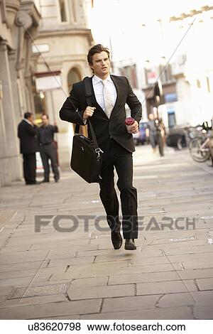 Businessman hurrying to work View Large Photo Image Stock Photo - Businessman hurrying to work. Fotosearch