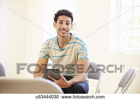 Businessman In Office Using Digital Tablet View Large Photo Image Stock Image - Businessman In Office Using Digital Tablet. Fotosearch