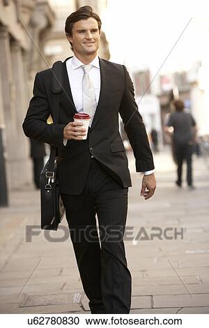 Stock Image - Businessman on the way to work. Fotosearch