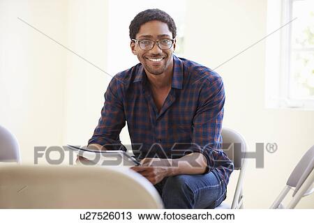Businessman Reading Document In Office View Large Photo Image Stock Image - Businessman Reading Document In Office. Fotosearch