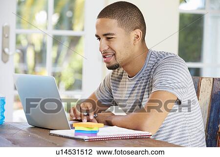 Stock Image - Businessman Working In Office At Home. Fotosearch