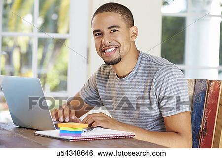 Stock Photograph - Businessman Working In Office At Home. Fotosearch