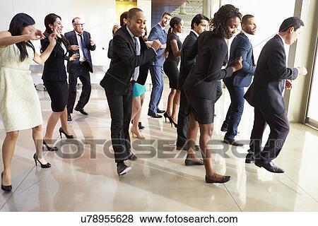 Businessmen And Businesswomen Dancing In Office Lobby View Large Photo Image Stock Photo - Businessmen And Businesswomen Dancing In Office Lobby. Fotosearch