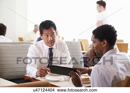 Businessmen Meeting Over Breakfast In Hotel Restaurant View Large Photo Image Picture - Businessmen Meeting Over Breakfast In Hotel Restaurant. Fotosearch