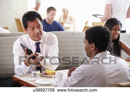 Businessmen Meeting Over Breakfast In Hotel Restaurant View Large Photo Image Stock Photo - Businessmen Meeting Over Breakfast In Hotel Restaurant. Fotosearch