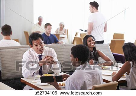 Businessmen Meeting Over Breakfast In Hotel Restaurant View Large Photo Image Stock Photograph - Businessmen Meeting Over Breakfast In Hotel Restaurant. Fotosearch