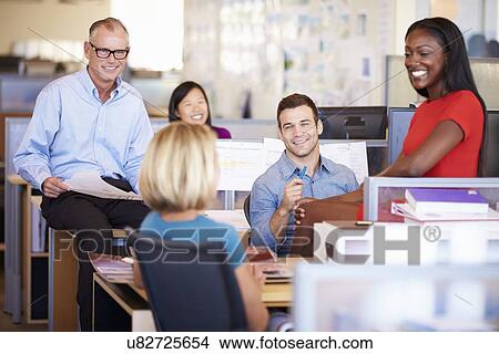Picture - Businesspeople Having Meeting In Modern Open Plan Office. Fotosearch