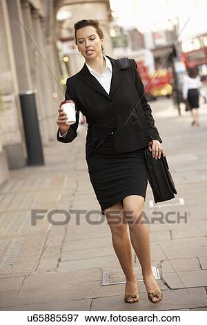 Stock Photo - Businesswoman hurrying to work. Fotosearch