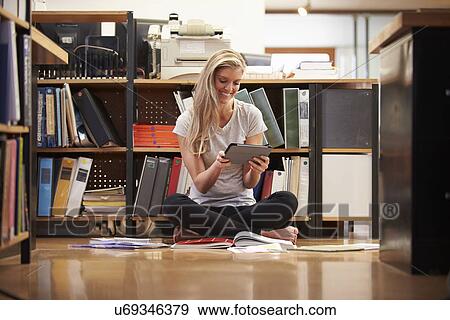 Businesswoman Sitting On Office Floor With Digital Tablet View Large Photo Image Stock Photo - Businesswoman Sitting On Office Floor With Digital Tablet. Fotosearch