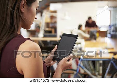 Businesswoman Using Digital Tablet In Modern Office View Large Photo Image Stock Image - Businesswoman Using Digital Tablet In Modern Office. Fotosearch