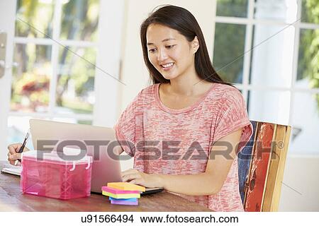 Picture - Businesswoman Working In Office At Home. Fotosearch