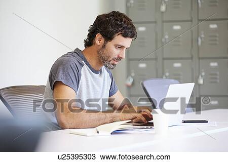 Casually Dressed Man Working In Design Studio View Large Photo Image Stock Image - Casually Dressed Man Working In Design Studio. Fotosearch