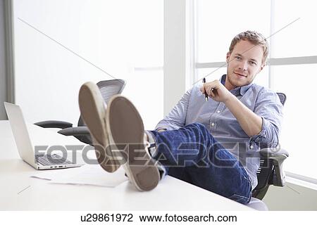 Casually Dressed Man Working In Design Studio View Large Photo Image Stock Image - Casually Dressed Man Working In Design Studio. Fotosearch