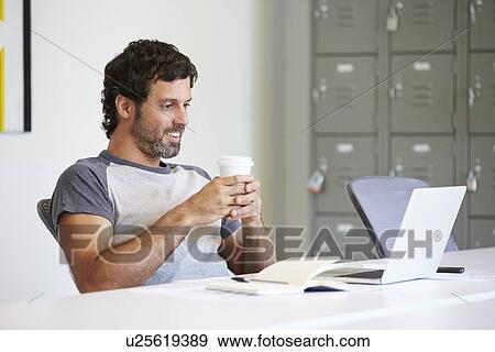 Casually Dressed Man Working In Design Studio View Large Photo Image Stock Photo - Casually Dressed Man Working In Design Studio. Fotosearch