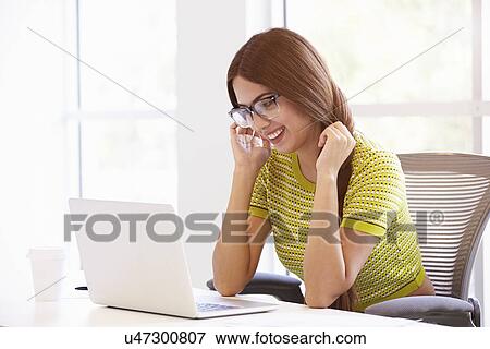 Casually Dressed Woman Working In Design Studio View Large Photo Image Stock Photo - Casually Dressed Woman Working In Design Studio. Fotosearch