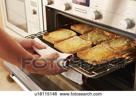 Cheese On Toast Being Grilled In Oven View Large Photo Image Stock Photograph - Cheese On Toast Being Grilled In Oven. Fotosearch