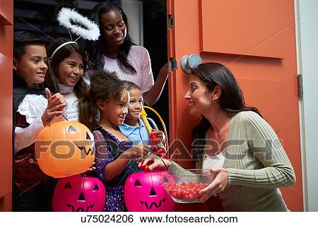 Children Going Trick Or Treating With Mother View Large Photo Image Stock Photograph - Children Going Trick Or Treating With Mother. Fotosearch