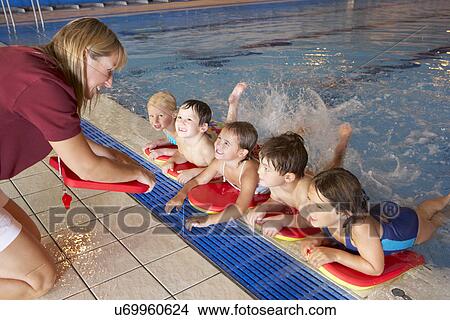 Picture - Children having swimming lesson. Fotosearch
