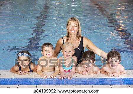 Children having swimming lesson View Large Photo Image Stock Image - Children having swimming lesson. Fotosearch