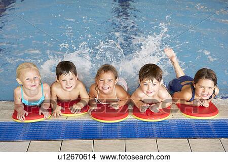 Children in swimming pool View Large Photo Image Picture - Children in swimming pool. Fotosearch