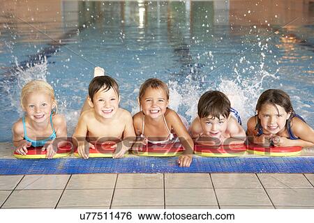 Stock Photograph - Children in swimming pool. Fotosearch