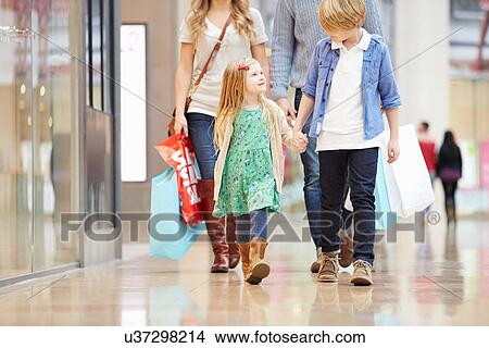 Picture - Children On Trip To Shopping Mall With Parents. Fotosearch
