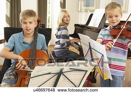 Children playing musical instruments at home View Large Photo Image Stock Photo - Children playing musical instruments at home. Fotosearch