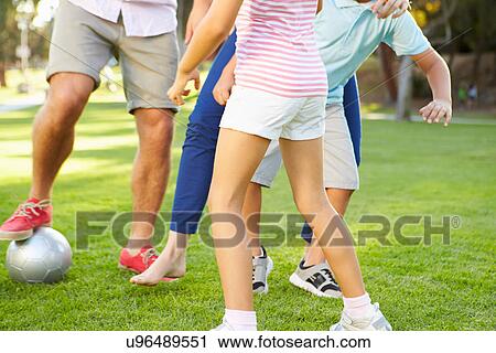 Close Up Of Family Playing Soccer In Park Together View Large Photo Image Stock Image - Close Up Of Family Playing Soccer In Park Together. Fotosearch