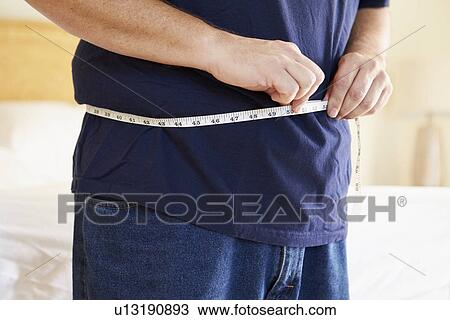 Close Up Of Overweight Man Measuring Waist View Large Photo Image Stock Image - Close Up Of Overweight Man Measuring Waist. Fotosearch