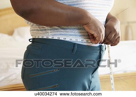 Close Up Of Overweight Woman Measuring Waist View Large Photo Image Picture - Close Up Of Overweight Woman Measuring Waist. Fotosearch