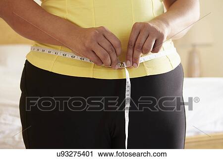 Close Up Of Overweight Woman Measuring Waist View Large Photo Image Stock Image - Close Up Of Overweight Woman Measuring Waist. Fotosearch