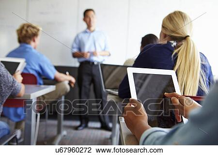 Close Up Of Pupil Using Digital Tablet In Classroom View Large Photo Image Stock Image - Close Up Of Pupil Using Digital Tablet In Classroom. Fotosearch