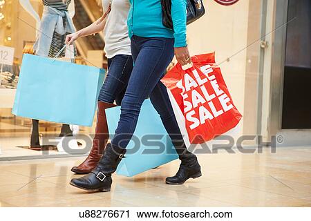Close Up Of Shoppers Carrying Bags In Mall View Large Photo Image Stock Image - Close Up Of Shoppers Carrying Bags In Mall. Fotosearch