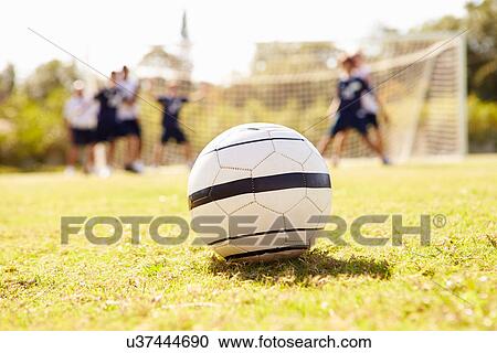 Close Up Of Soccer Ball With Players In Background View Large Photo Image Stock Image - Close Up Of Soccer Ball With Players In Background. Fotosearch