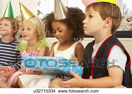Clown entertaining children at party View Large Photo Image Picture - Clown entertaining children at party. Fotosearch