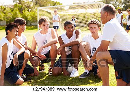 Coach Giving Team Talk To Male High School Soccer Team View Large Photo Image Stock Photo - Coach Giving Team Talk To Male High School Soccer Team. Fotosearch