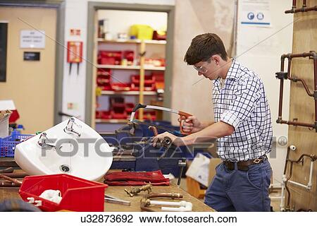 College Students Studying Plumbing Working At Bench View Large Photo Image Stock Image - College Students Studying Plumbing Working At Bench. Fotosearch