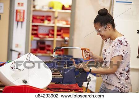 Stock Image - College Students Studying Plumbing Working At Bench. Fotosearch