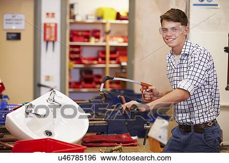 College Students Studying Plumbing Working At Bench View Large Photo Image Stock Photograph - College Students Studying Plumbing Working At Bench. Fotosearch