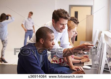 College Students Using Computers On Media Studies Course View Large Photo Image Picture - College Students Using Computers On Media Studies Course. Fotosearch
