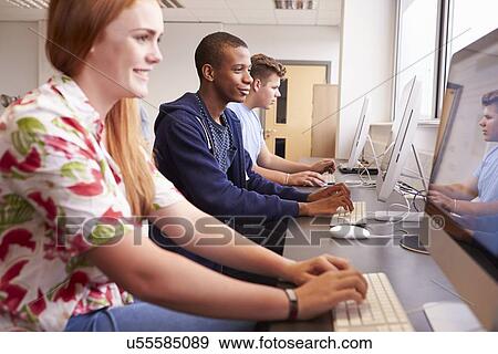 Stock Photo - College Students Using Computers On Media Studies Course. Fotosearch