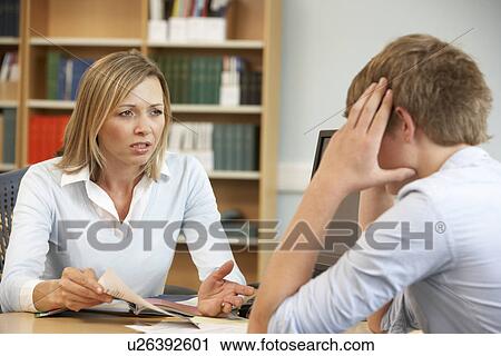 Stock Image - College tutor with student. Fotosearch