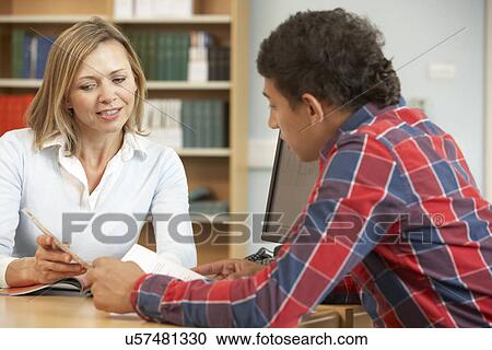 College tutor with student View Large Photo Image Stock Image - College tutor with student. Fotosearch