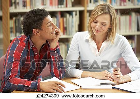 Stock Photo - College tutor with student. Fotosearch