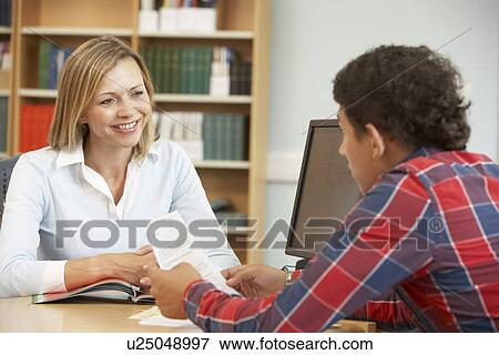 College tutor with student View Large Photo Image Stock Photo - College tutor with student. Fotosearch