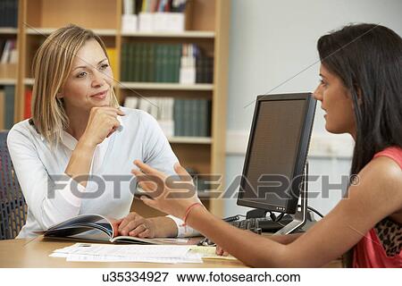 College tutor with student View Large Photo Image Stock Photo - College tutor with student. Fotosearch