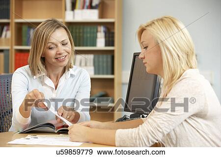 College tutor with student View Large Photo Image Stock Photo - College tutor with student. Fotosearch