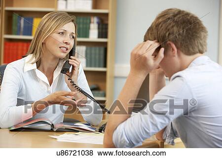College tutor with student View Large Photo Image Stock Photo - College tutor with student. Fotosearch