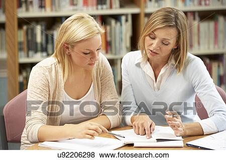 College tutor with student View Large Photo Image Stock Photo - College tutor with student. Fotosearch